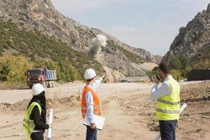 construction workers controlling explosion photo