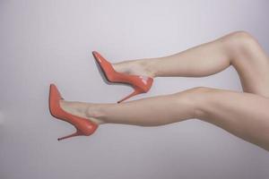 legs with red high hill shoes photo