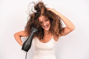 Beautiful girl drying her hair photo