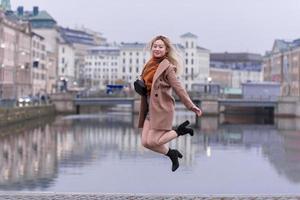 Outdoor portrait of young Asian beautiful fashionable happy woman. Model posing outdoor. photo