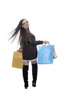 Happy woman full body portrait with shopping bag on isolated studio background. photo