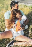 Couple playing American football on hot summer day. Couple playing Rugby photo shoot