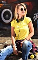 cool skateboard woman at a public graffiti park photo