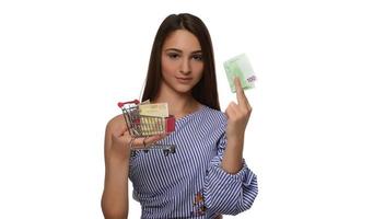 Young woman holding euro money isolated on white photo