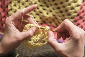 unrecognizable woman knitting photo