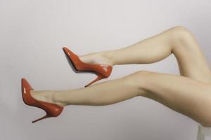 legs with red high hill shoes photo