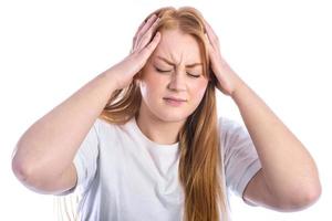 Portrait of beautiful young woman touching her temples feeling stress photo