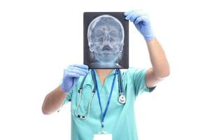 medical concept. doctor holding x ray from a human head photo