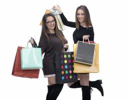 Happy friends with shopping bag on isolated studio background. photo