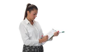 Happy young businesswoman doing business presentation at whiteboard, smiling, isolated on white background. photo