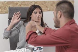 Emotional colleagues fighting in office. Workplace conflict photo