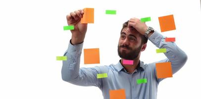 Portrait of a smiling businessman writing Business Plan on the screen photo