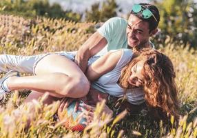 Couple playing American football on hot summer day. Couple playing Rugby photo shoot