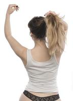 woman arranging her hair photo