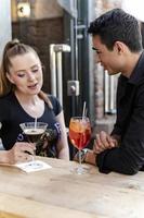 love couple sitting in the coffee bar enjoying beautiful fall day photo