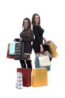 two happy female friends with shopping bag on isolated studio background. photo