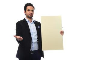 Arab businessman holding white board. advertisement concept. isolated photo