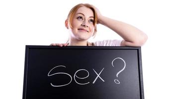 woman holding sex sign photo