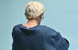back view of a unknown blond woman photo
