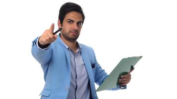 Arab businessman holding paperwork on clipboard and pointing with his finger. isolated on white photo