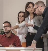 Group of designers programmers working on a new project at the office. photo