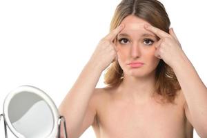 Young woman with adhesive bandage on her face photo