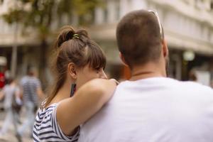 Couple of tourists having fun walking on city street at holiday - Happy friends laughing together on vacation - People and holidays concept photo