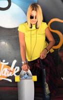 cool skateboard woman at a public graffiti park photo