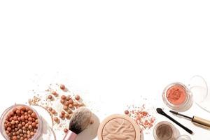 Crushed eyeshadow, face powder and makeup brushes isolated on white background. Makeup composition with copy space, free space for text. photo