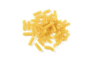 Fusilli pasta isolated on white background. Heap of uncooked dried fusilli, traditional Italian cuisine. Top view. photo