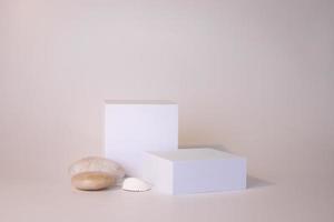 White podium on the white background. Podium for product, cosmetic presentation. Creative mock up. Pedestal or platform for beauty products. photo