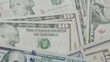 USD currency , Many dollar bank notes Placed on the table.The  Dollar is the currency of USA that is used to change, buy, sell, accumulate, and invest in united kingdom's state people. video