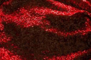 Shiny and glittering red fabric with sequins. Abstract background. Events, celebrations, Christmas, New Year. Trendy backdrop. photo