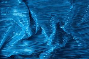 Shiny blue fabric. Abstract background. Events, celebrations, Christmas, New Year. Trendy backdrop. photo