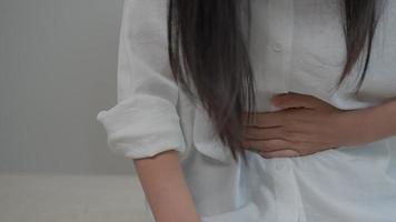 Flatulence woman, hand hold on stomach from ache, suffer from food poisoning, abdominal pain, colon problem, gastritis, diarrhea, Patient belly, abdomen, inflammation, mensuration, intestines cancer. video