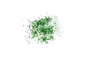Green glitter confetti isolated on white background. Shiny particles. Party, Merry Christmas, Happy New year decoration. photo