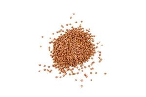 Pile of buckwheat isolated on white background. Healthy food. Top view. photo
