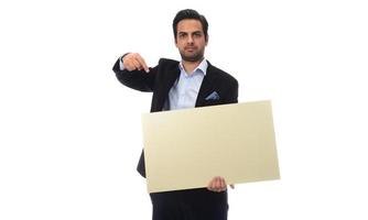 Arab businessman holding white board. advertisement concept. isolated photo