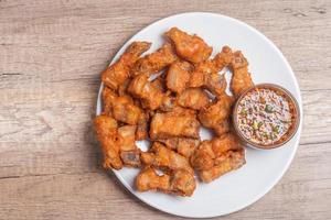 Deep fried pork belly with fish sauce and spicy dipping sauce photo