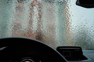 Inside view from car covered in freezing rain photo