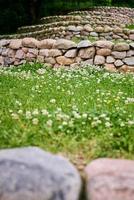 Stones and green grass, front yard. Landscape design photo