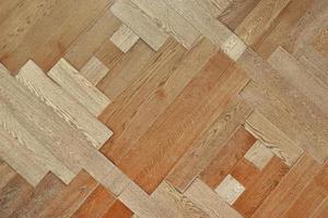 Wooden floor with pattern made of thin planks. Parquet background photo