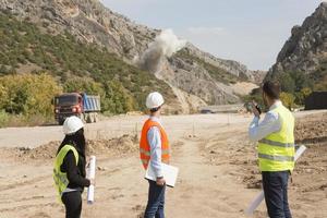 construction workers controlling explosion photo