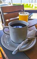 Cup of americano black coffee in restaurant Mexico. photo