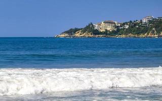 Extremely huge big surfer waves at beach Puerto Escondido Mexico. photo