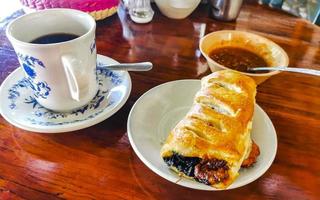 Typical Mexican dishes Empanadas Tamales Rollos with Coffee Oaxaca Mexico. photo