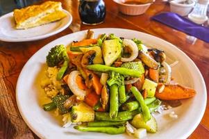 Fried rice and vegetables on white plate Puerto Escondido Mexico. photo