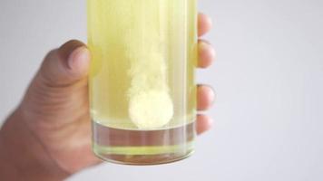 Effervescent soluble tablet pills in a glass of water video