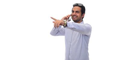 Arab businessman holding paperwork on clipboard and pointing with his finger. isolated on white photo