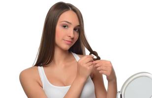 My hair regime has made my hair stronger. Studio shot of a young beautiful woman with long gorgeous hair posing photo